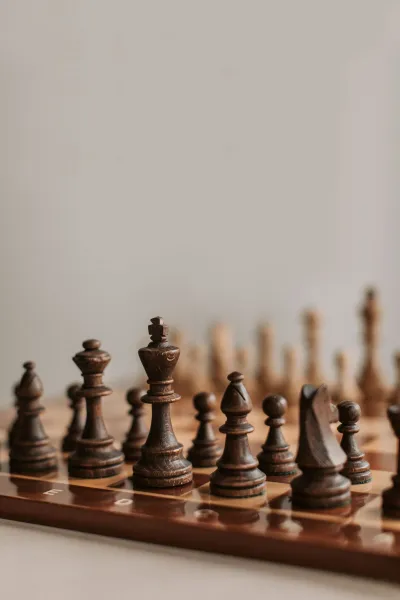 A wooden chess set on a board